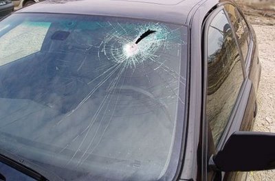 BMW windshield penetrated by piece of metal photo BMW windshield penetrated by piece of metal