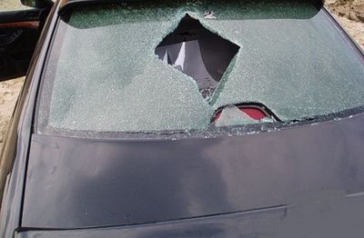 BMW windshield penetrated by piece of metal photo BMW windshield penetrated by piece of metal