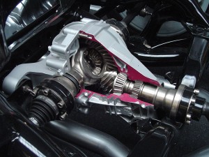 A cutaway view of a car final drive unit which contains the differential